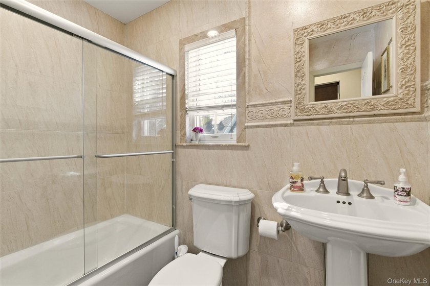 FLOWER HILL, ROSLYN | BRICK CENTER HALL COLONIAL. Located on a - photo 18