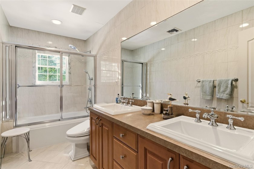 FLOWER HILL, ROSLYN | BRICK CENTER HALL COLONIAL. Located on a - photo 27