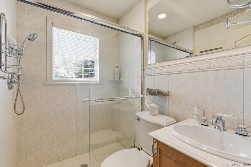 FLOWER HILL, ROSLYN | BRICK CENTER HALL COLONIAL. Located on a - photo 29