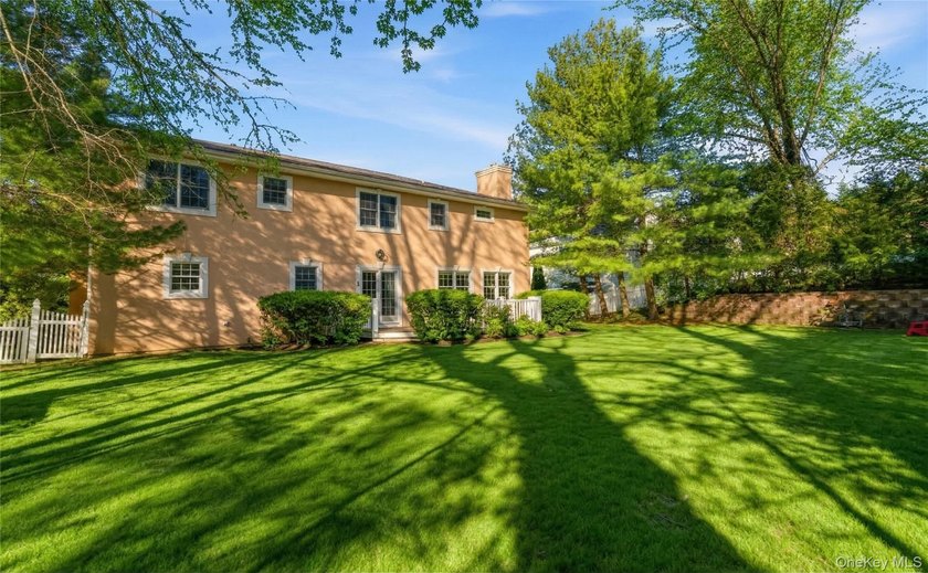 FLOWER HILL, ROSLYN | BRICK CENTER HALL COLONIAL. Located on a - photo 35