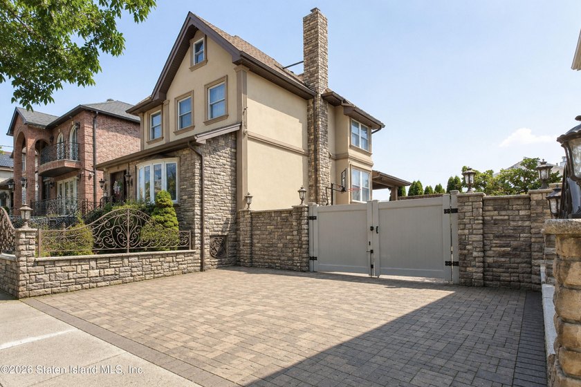 Welcome to this exceptional detached two-family residence where - photo 3