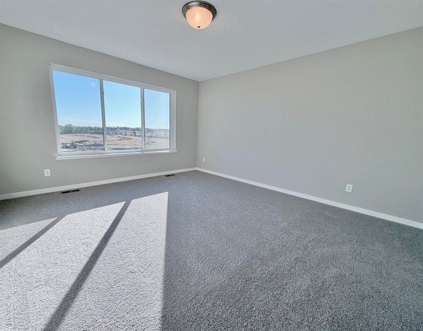 Highlights include a spacious 4 BAY GARAGE, Two Story modern - photo 11