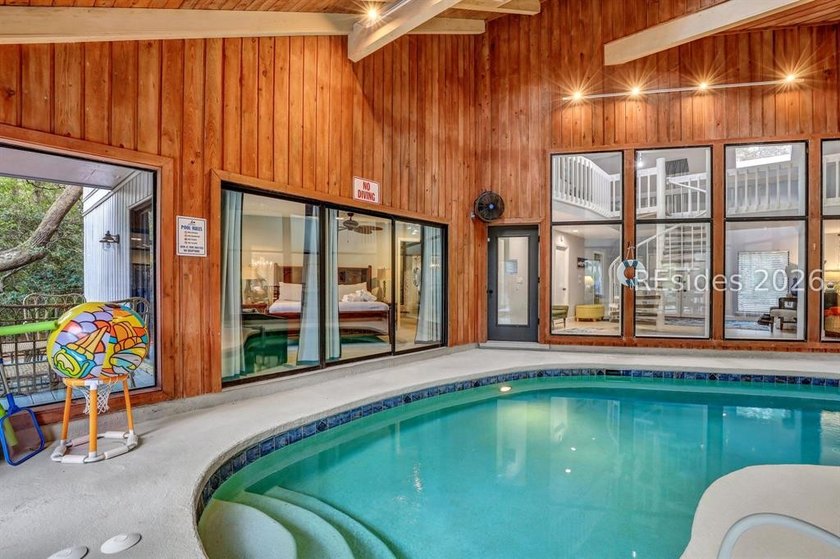 Unique home with a covered, heated pool and bi-fold doors that - photo 7