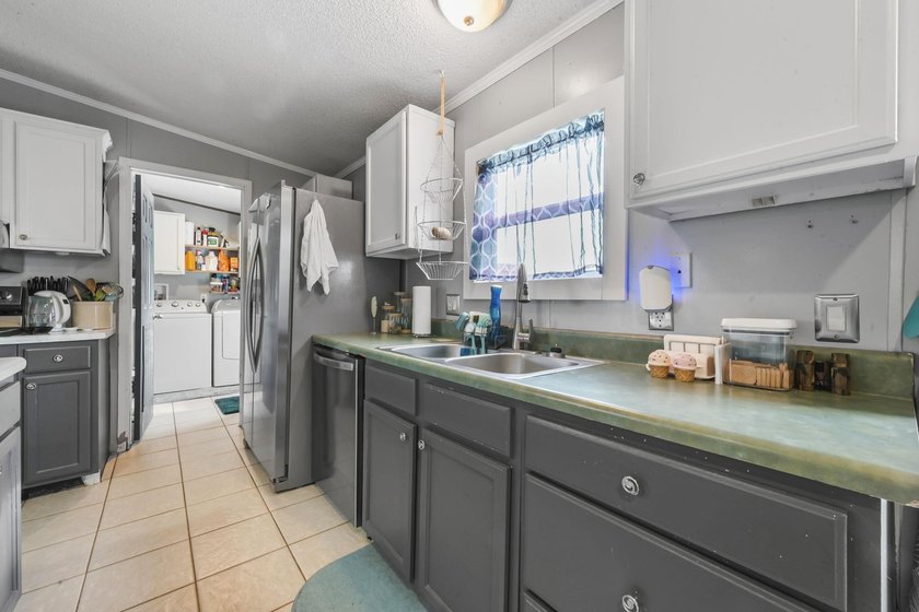 Welcome to 6043 East West Way, an inviting coastal home nestled - photo 4