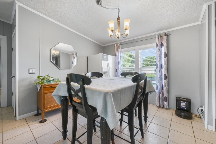 Welcome to 6043 East West Way, an inviting coastal home nestled - photo 5