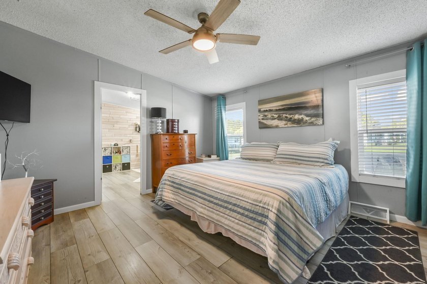 Welcome to 6043 East West Way, an inviting coastal home nestled - photo 7