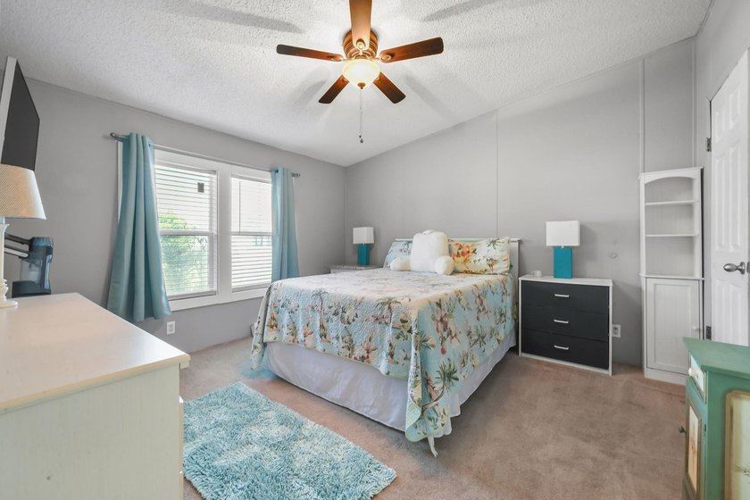 Welcome to 6043 East West Way, an inviting coastal home nestled - photo 10