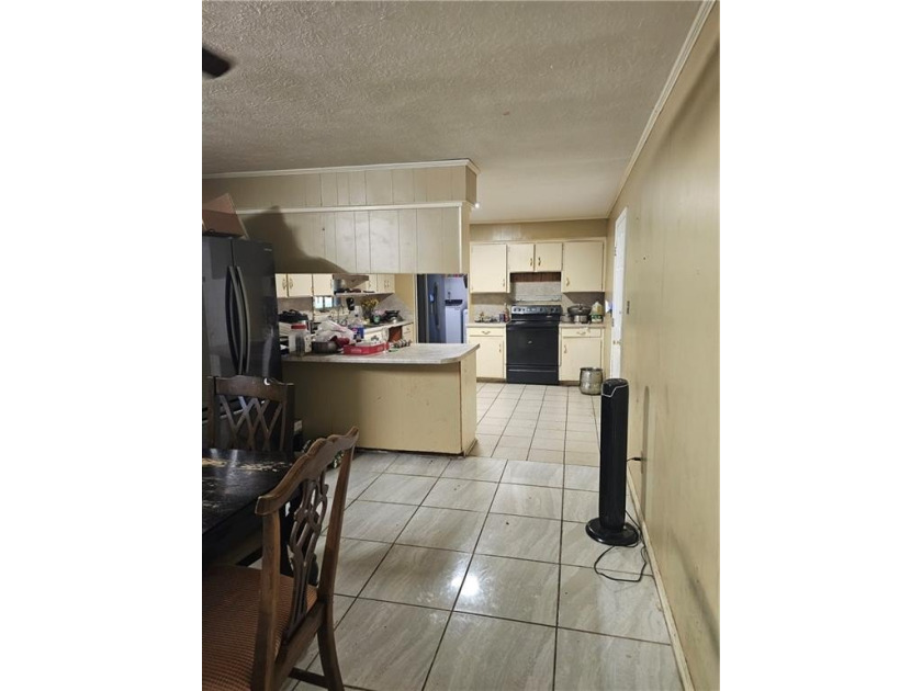 Great Location. 4 bedroom, 3 full bathroom homes is in need of - photo 5