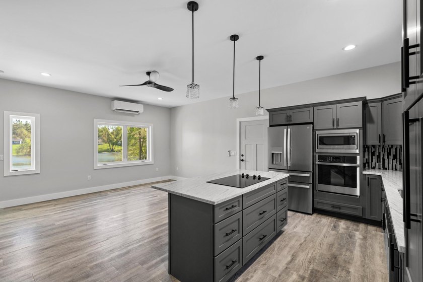Brand new construction on the beautiful Cheboygan River! Enjoy - photo 13