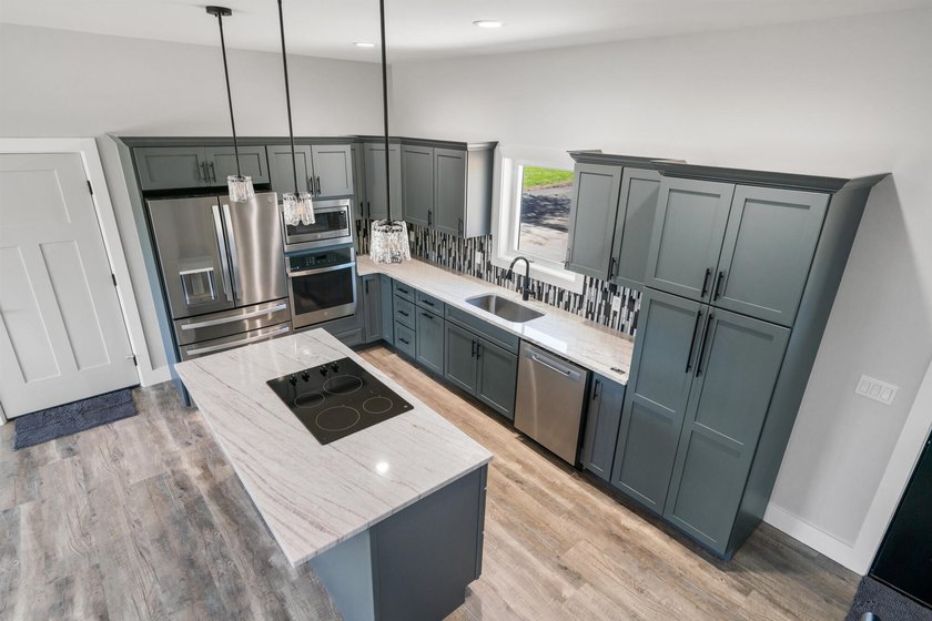 Brand new construction on the beautiful Cheboygan River! Enjoy - photo 19