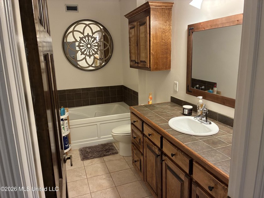Nestled among towering pines with peaceful pond views, this - photo 13