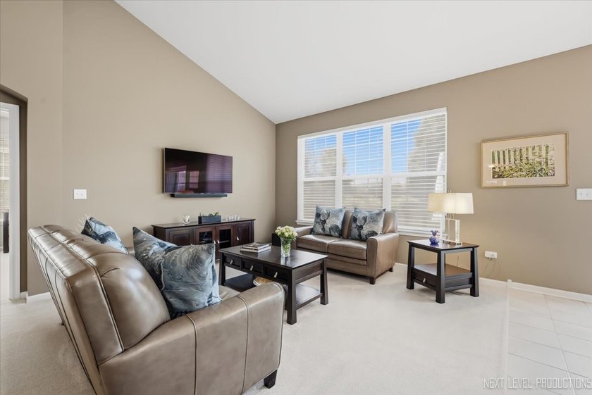 Enjoy carefree, low-maintenance living in this meticulously - photo 3