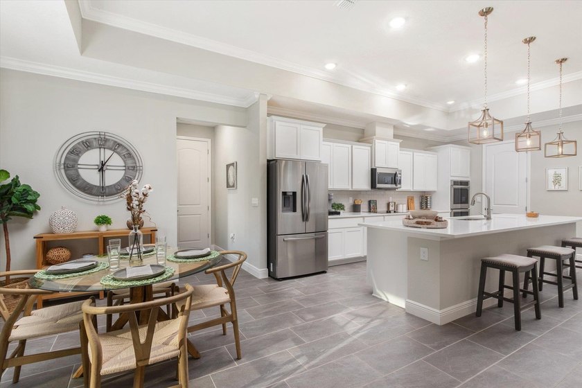 Former Model Home - Situated in Elegant Manor Estates, you will - photo 11
