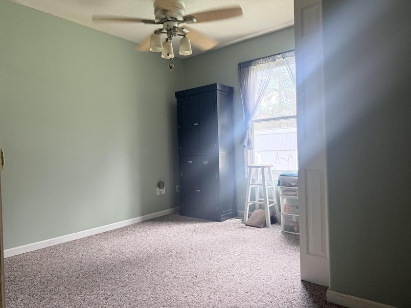 Charming 4-bedroom, 1-bath handicap accessible home nestled on a - photo 11