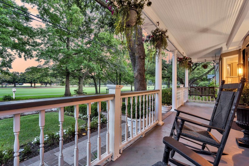 Tucked beneath a canopy of sweeping live oaks, this beautifully - photo 5