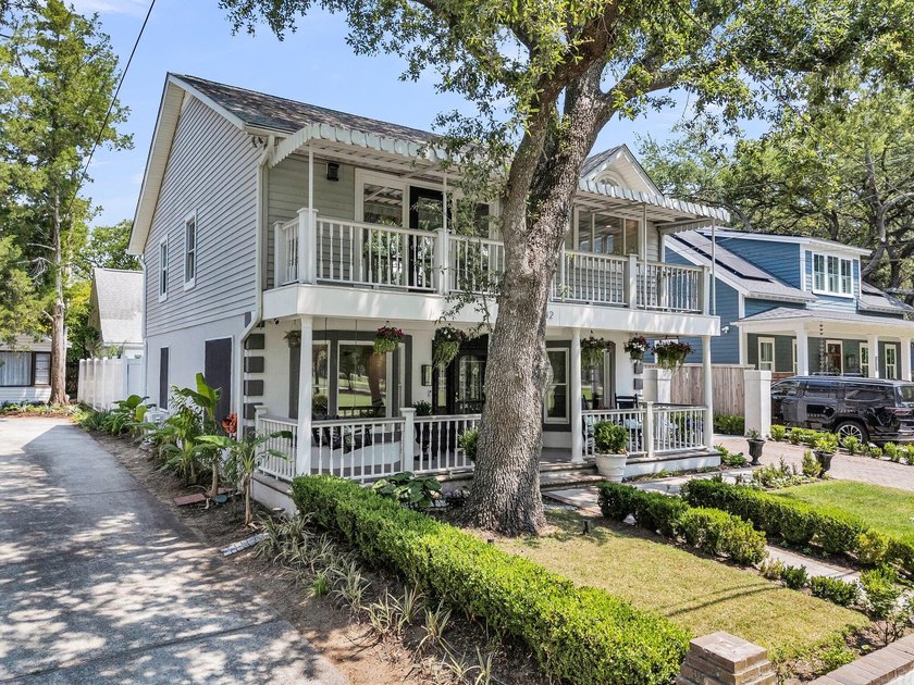 Tucked beneath a canopy of sweeping live oaks, this beautifully - photo 9