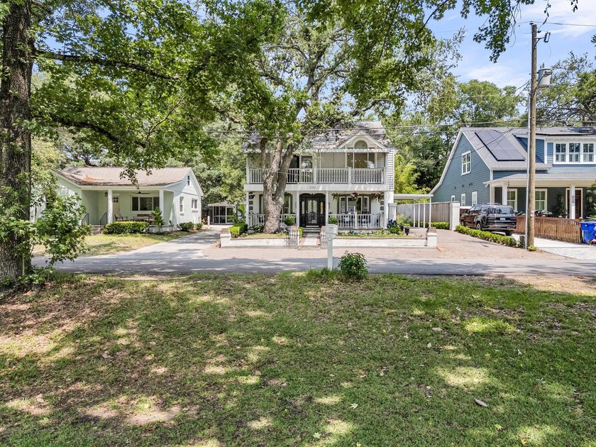 Tucked beneath a canopy of sweeping live oaks, this beautifully - photo 10