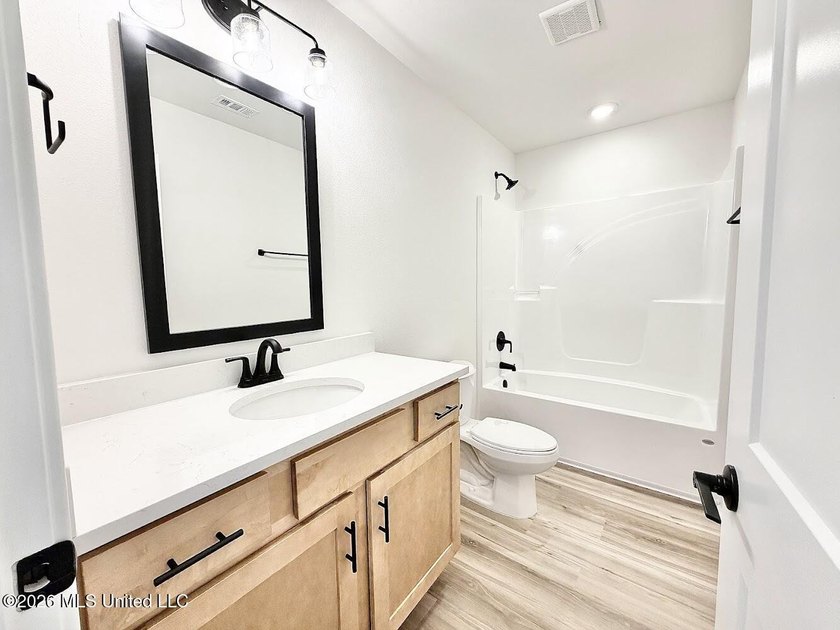 This beautifully designed 4 bedroom, 2 bath home blends modern - photo 17