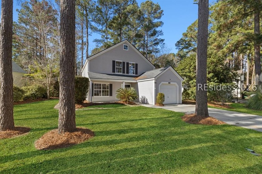 Freshly updated, this 4BR/2BA home located in The Farm offers a - photo 2