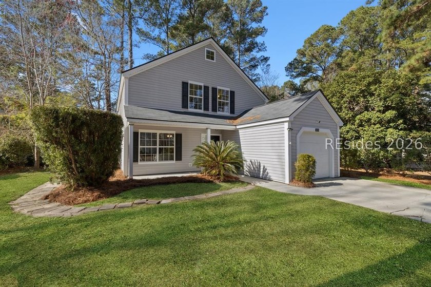 Freshly updated, this 4BR/2BA home located in The Farm offers a - photo 3