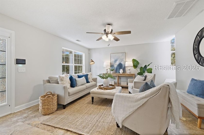 Freshly updated, this 4BR/2BA home located in The Farm offers a - photo 4