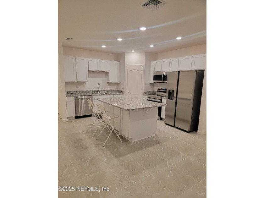 This 3-bedroom, 2 1/2 bathroom townhome is practically brand new - photo 2