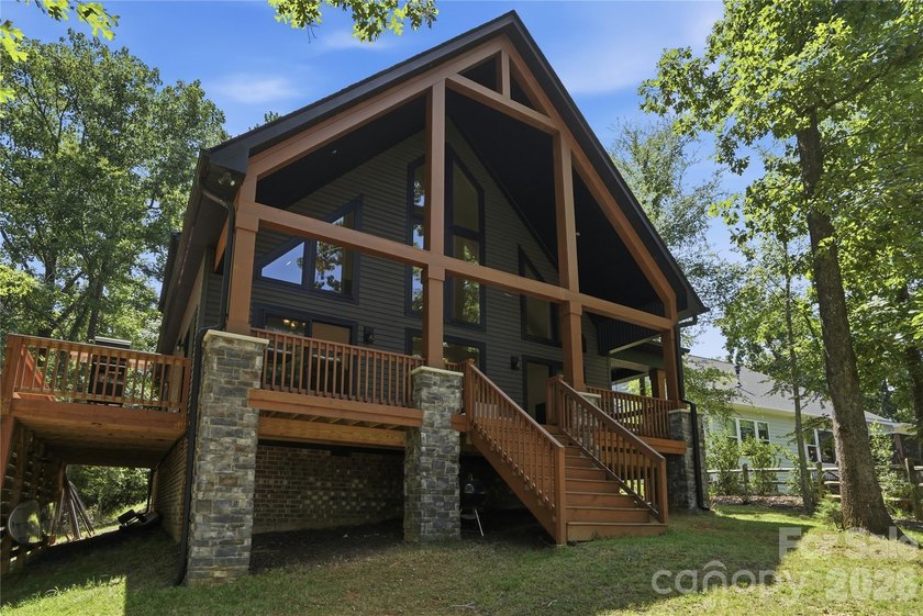 Peaceful waterfront retreat nestled on a beautifully wooded lot - photo 3