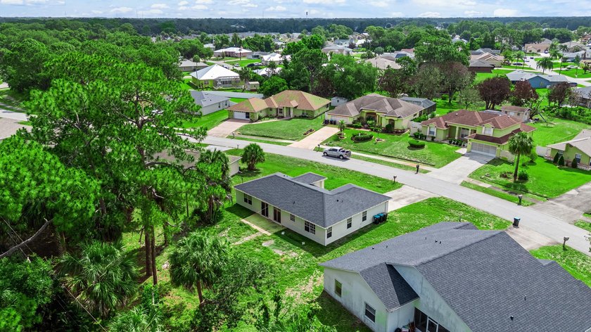 FRESHLY REMODELED Palm Bay home featuring a brand-new roof - photo 24
