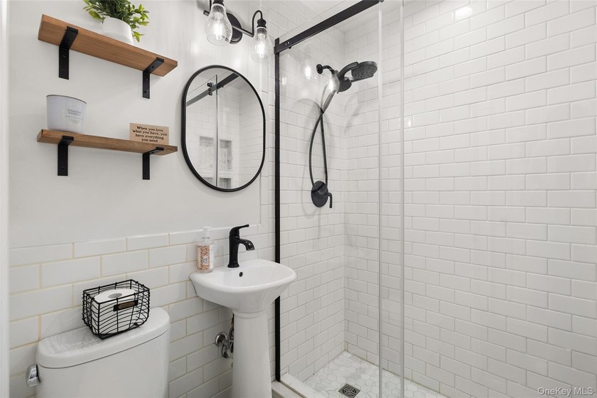 This beautifully renovated Colonial in East Islip sits on an - photo 11