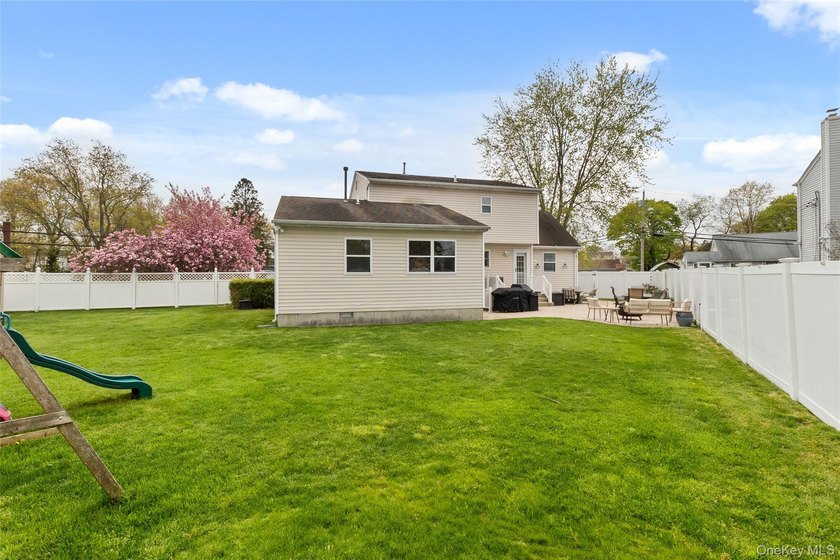 This beautifully renovated Colonial in East Islip sits on an - photo 20