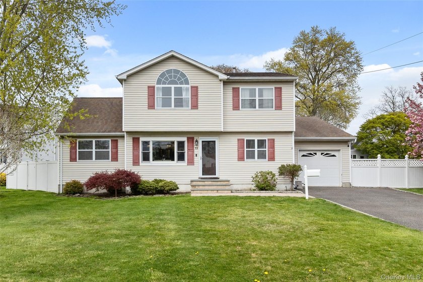 This beautifully renovated Colonial in East Islip sits on an - photo 24