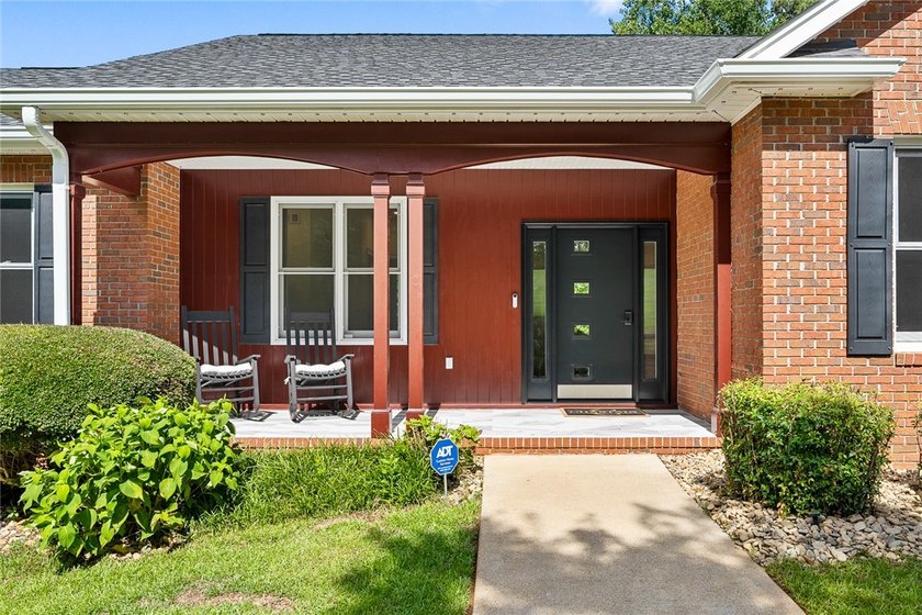 Nestled on the 12th hole in the gated community of Cross Creek - photo 4