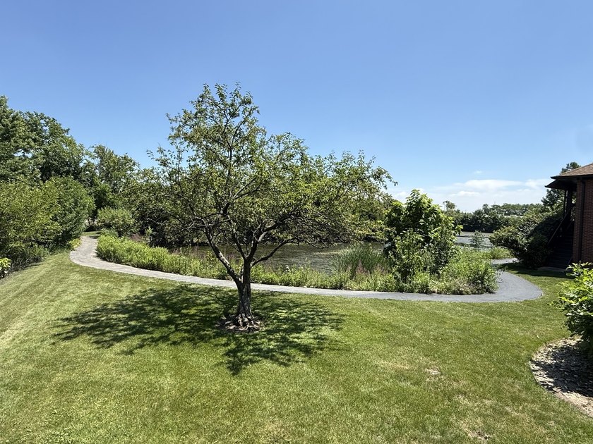 Welcome to this beautifully maintained second-floor condo in the - photo 19