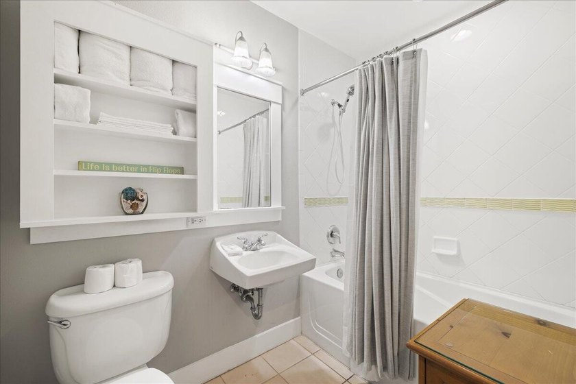 Escape to the perfect beach haven with this beautifully upgraded - photo 11