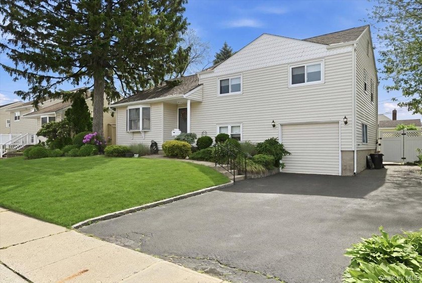 A charming expanded 3-bedroom, 2.5-bath split-level home located - photo 3