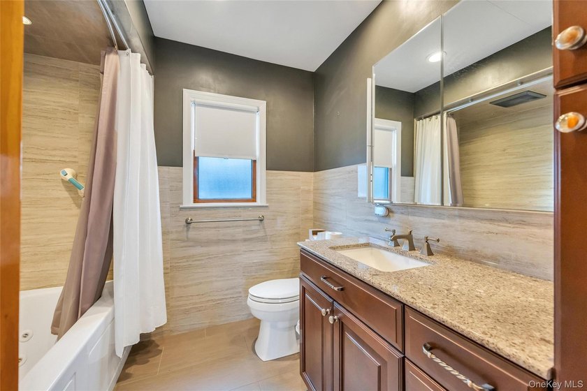 This beautifully renovated Cape in Oceanside offers 3 bedrooms - photo 26