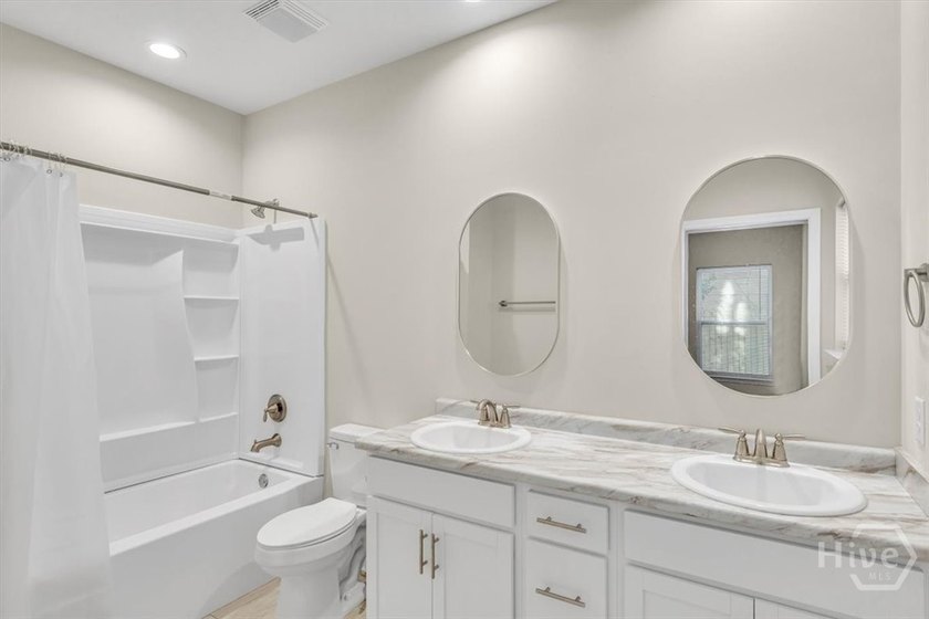 Newly constructed in 2024, this modern 3BR/2.5BA home offers an - photo 11