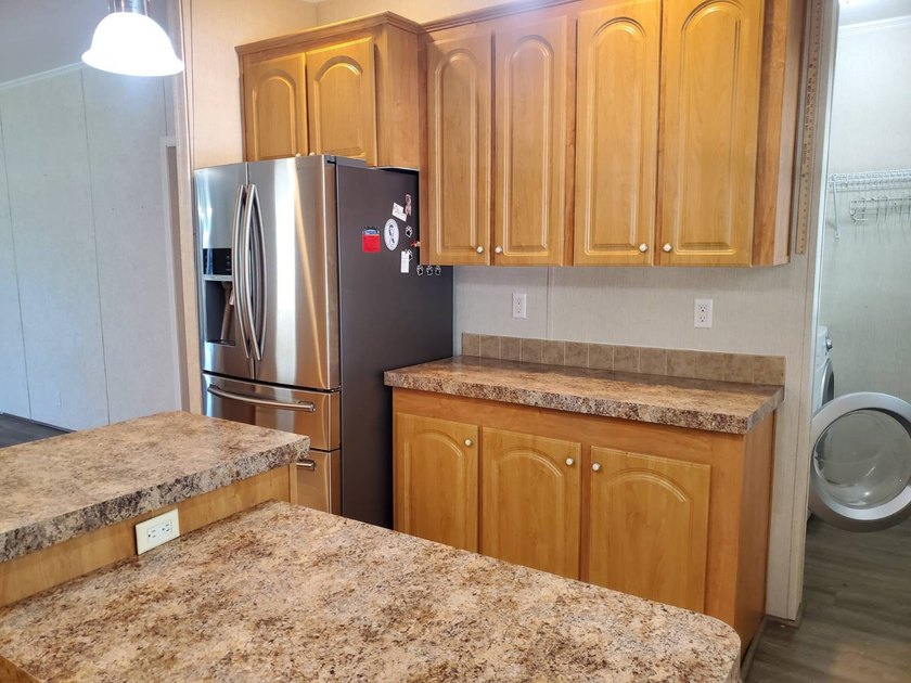 THIS HOME IS ON LEASED LAND WITH A MONTHLY LOT RENT OF $542 AND - photo 15