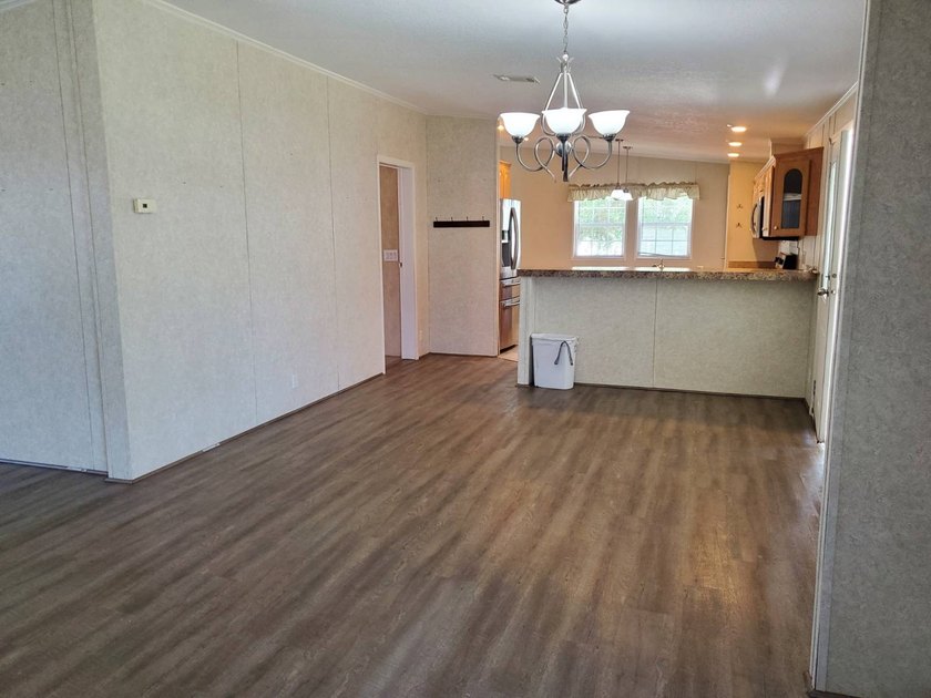 THIS HOME IS ON LEASED LAND WITH A MONTHLY LOT RENT OF $542 AND - photo 38