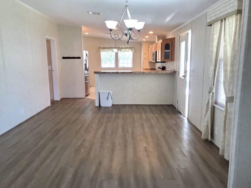 THIS HOME IS ON LEASED LAND WITH A MONTHLY LOT RENT OF $542 AND - photo 39
