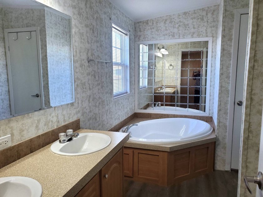 THIS HOME IS ON LEASED LAND WITH A MONTHLY LOT RENT OF $542 AND - photo 49