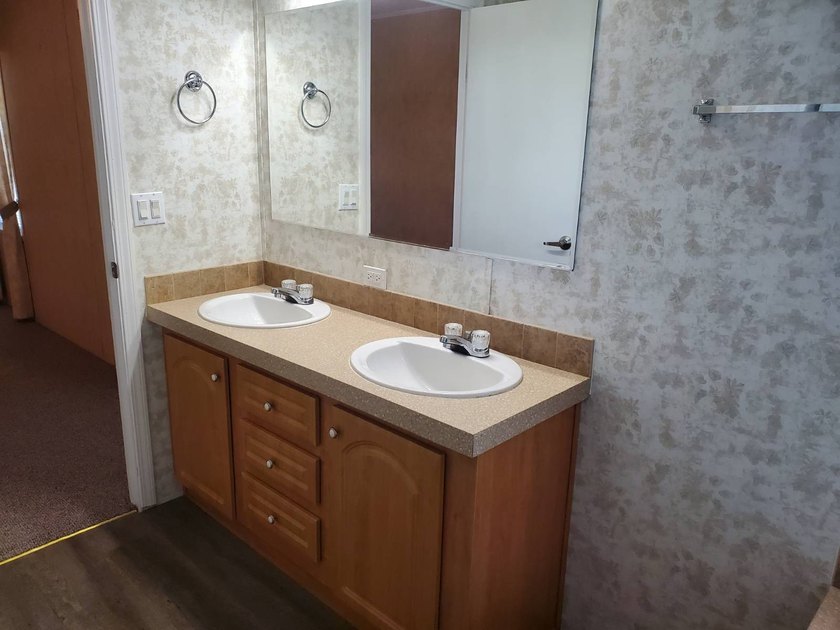 THIS HOME IS ON LEASED LAND WITH A MONTHLY LOT RENT OF $542 AND - photo 50