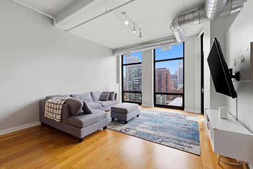Experience elevated city living in this well-maintained - photo 2