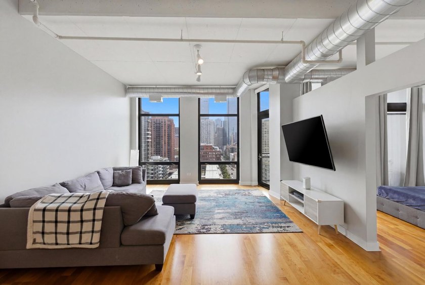 Experience elevated city living in this well-maintained - photo 3