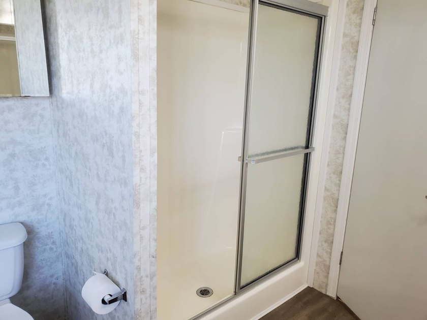 THIS HOME IS ON LEASED LAND WITH A MONTHLY LOT RENT OF $542 AND - photo 53