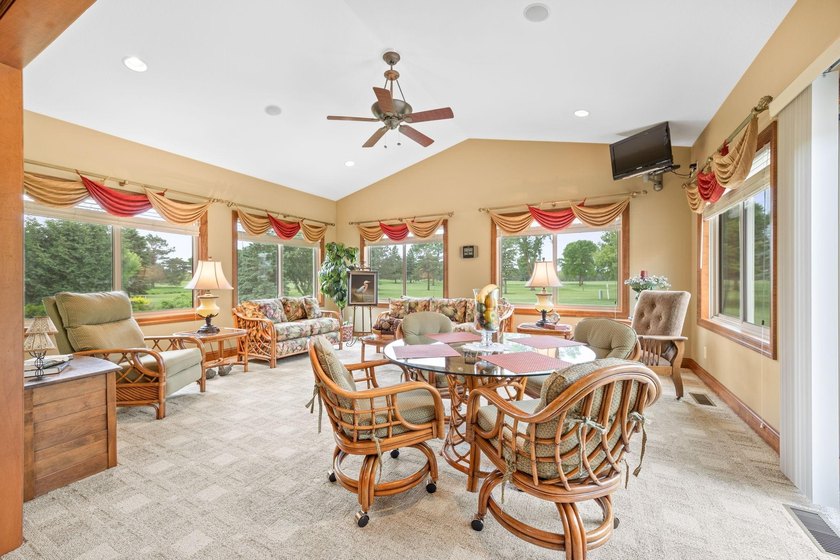 This stately patio home built by Larson Builders overlooks the - photo 12