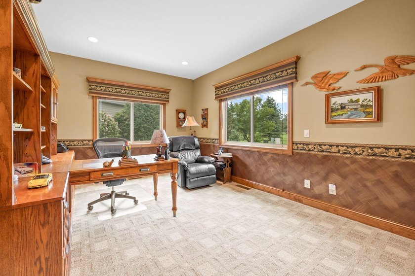 This stately patio home built by Larson Builders overlooks the - photo 24