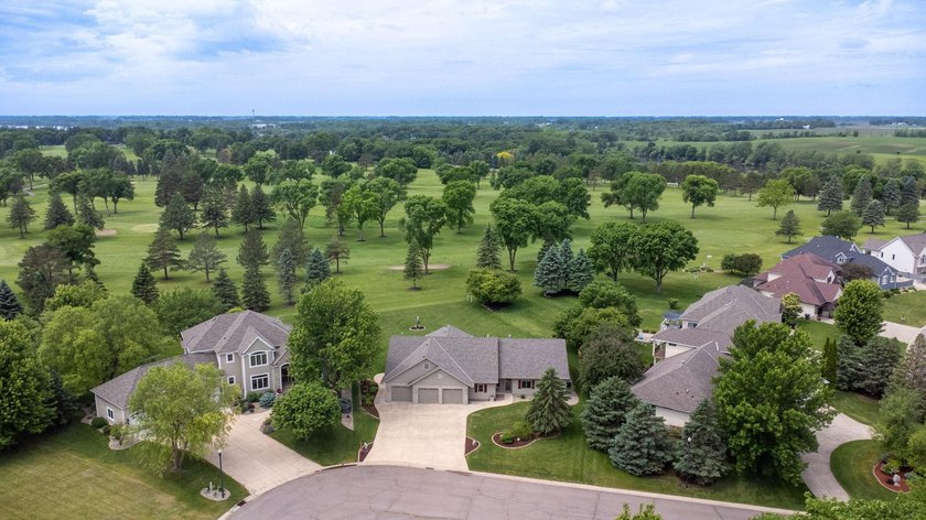 This stately patio home built by Larson Builders overlooks the - photo 35