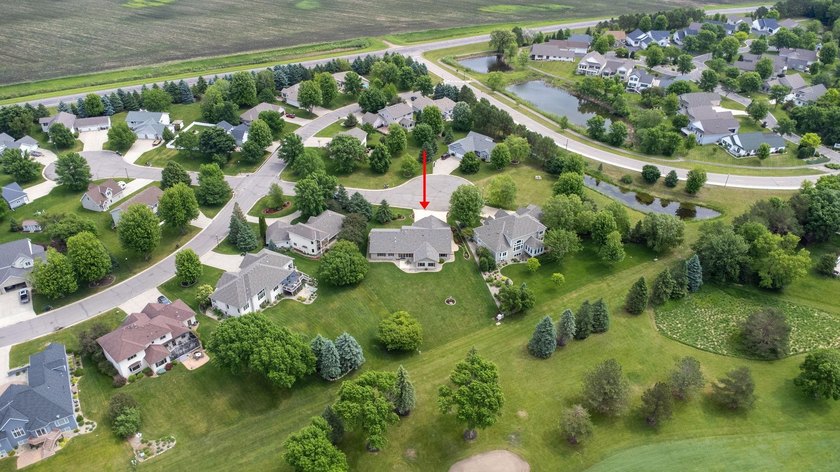 This stately patio home built by Larson Builders overlooks the - photo 39