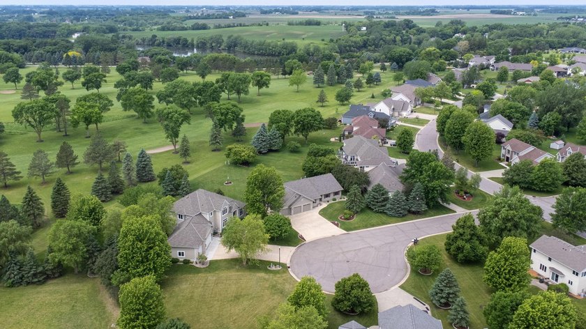 This stately patio home built by Larson Builders overlooks the - photo 42